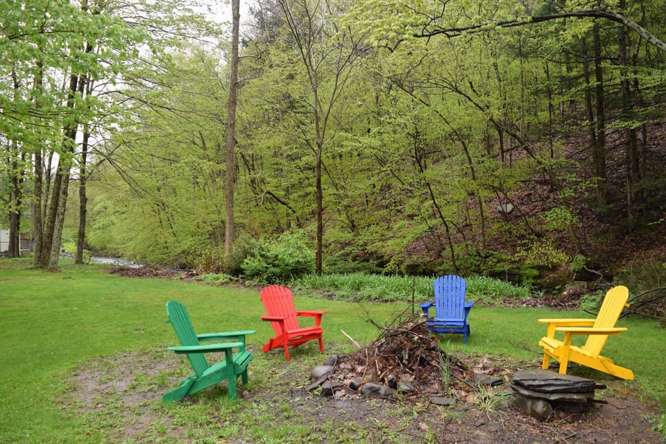 Make s'mores at the outdoor fire pit along the creek