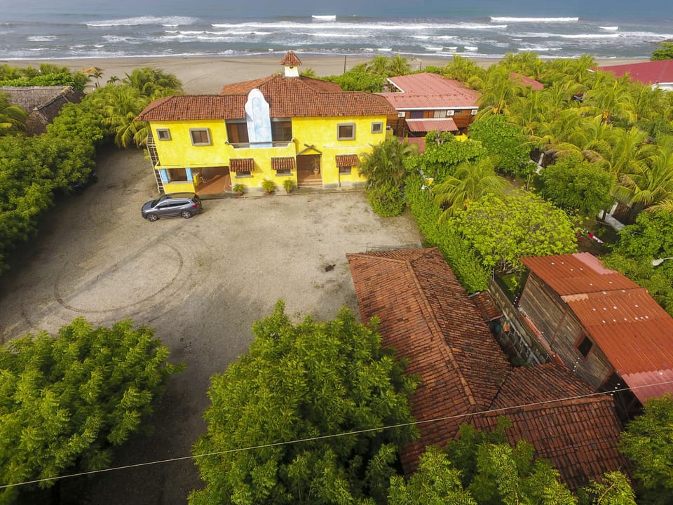 Back of the home parking, apartment and main house