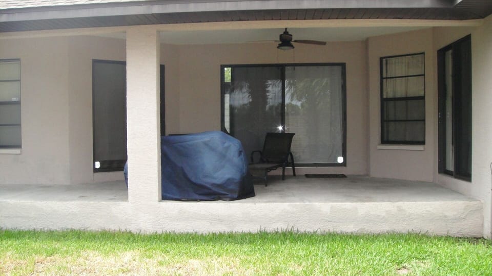 Large covered patio great for enjoying the sun or bbqing