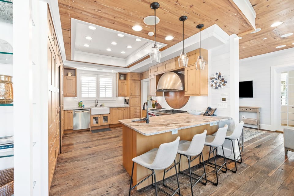 Large Kitchen with dual wolf ovens, dual fridge/freezers, and built in coffee machine.