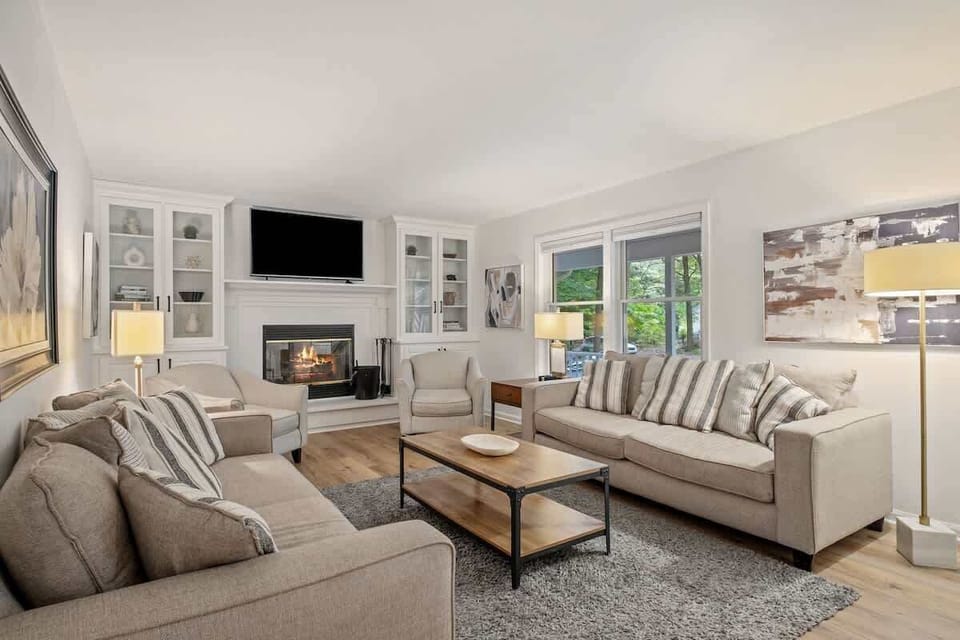 "Cozy vibes and fireplace dreams! ✨ There's nothing like snuggling up on the couch with a good book or movie in this perfect living room!"