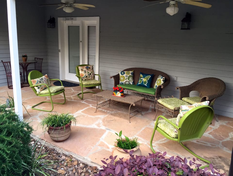 Private porch of the Juniper Room with ceiling fans