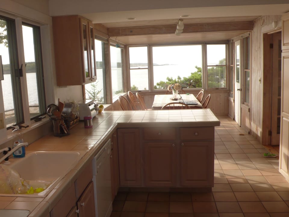 kitchen looking through to dining area (looking out at open ocean & Small Point