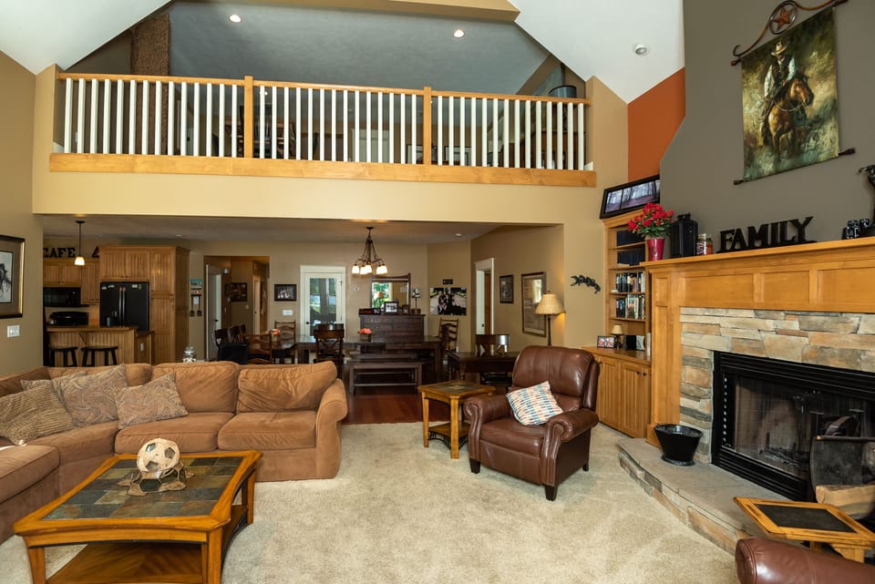 Family room with view of dining area and loft area