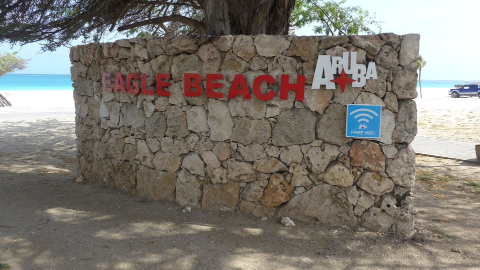 Steps away from the serene, white sand Eagle Beach where you can walk for miles