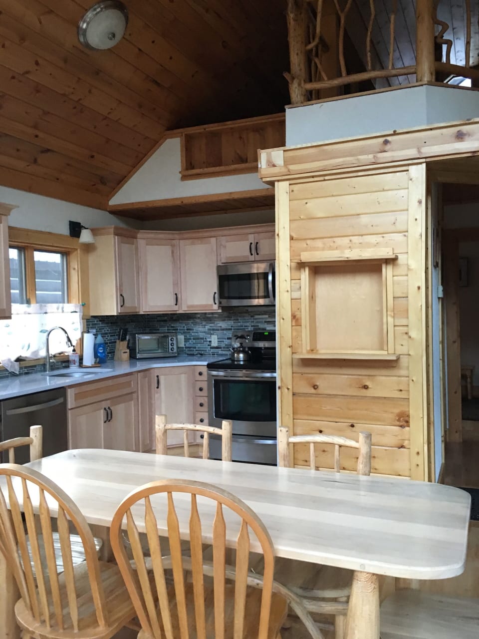 The fully equipped kitchen has a large fridge for all your groceries.