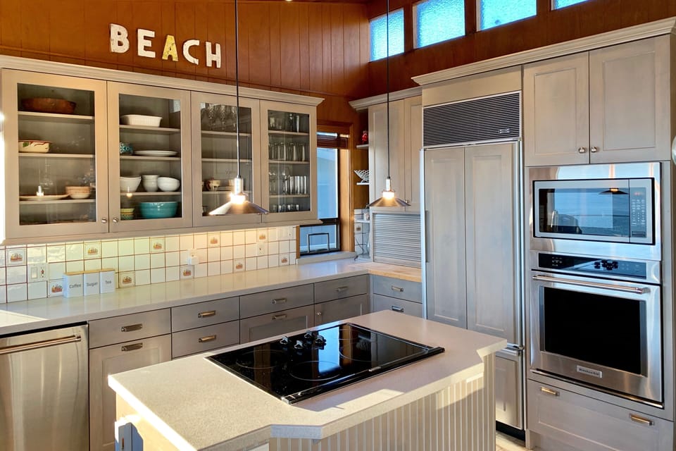 Bright chef's kitchen with subzero, thermador, kitchen aid appliances. 