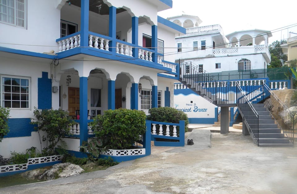 Side angle view of the Villa. Outside staircase leading to upper level.