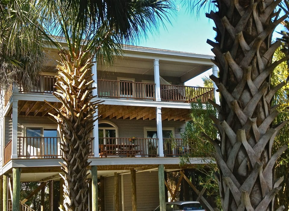 View of our beach house showing upper and lower decks. Outdoor shower in back.