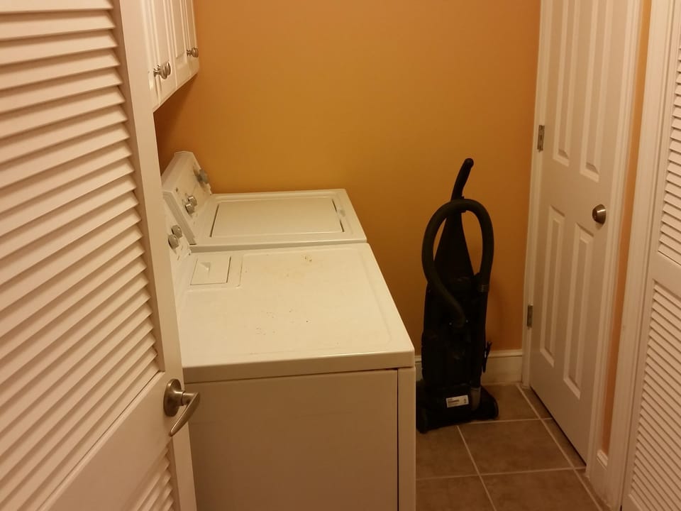 Enclosed laundry room with washer and dryer 