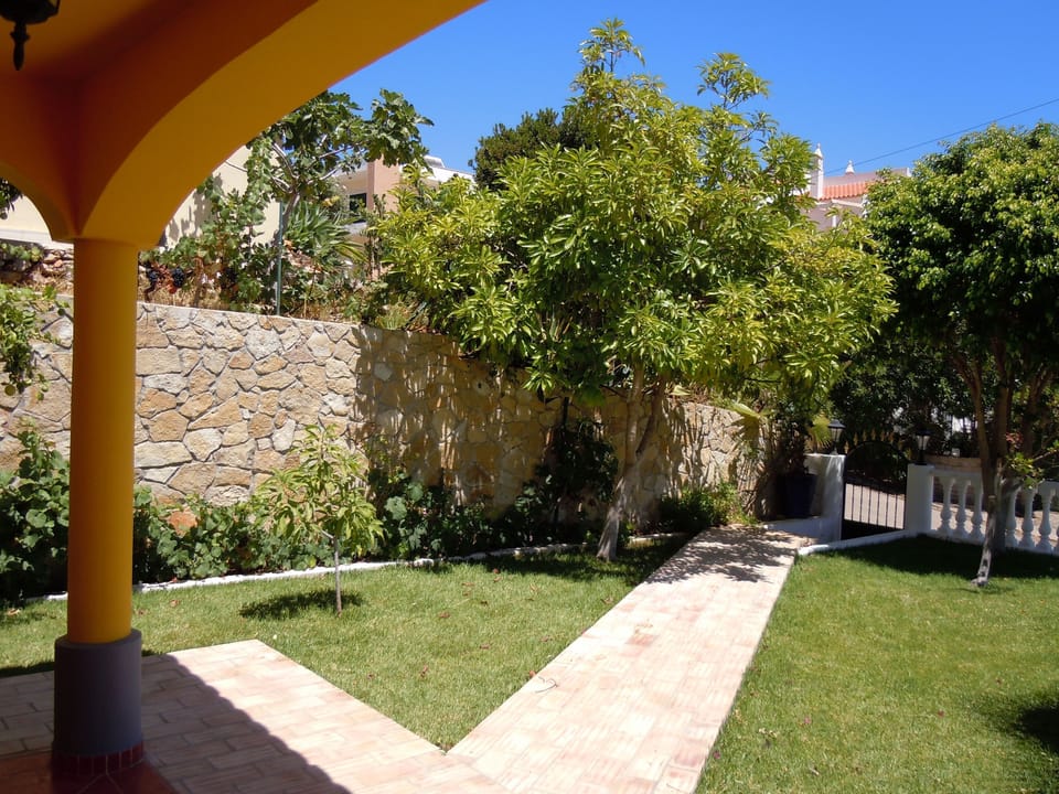 Front entrance with diferent types of trees