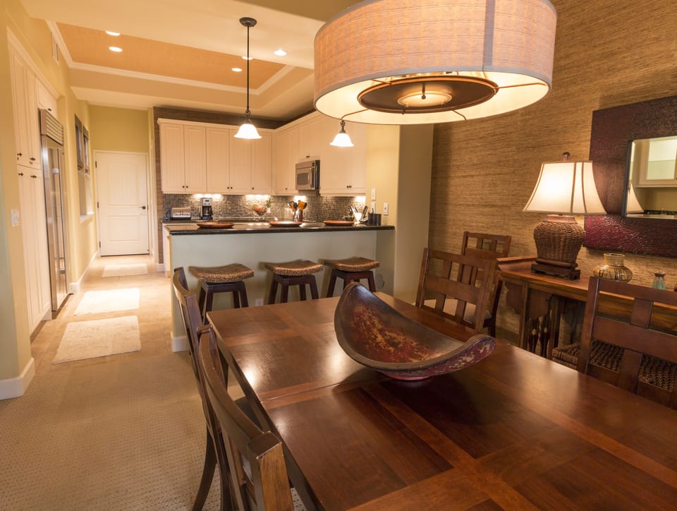Pull up a stool while dinner's being prepped and dine in style at the wood table