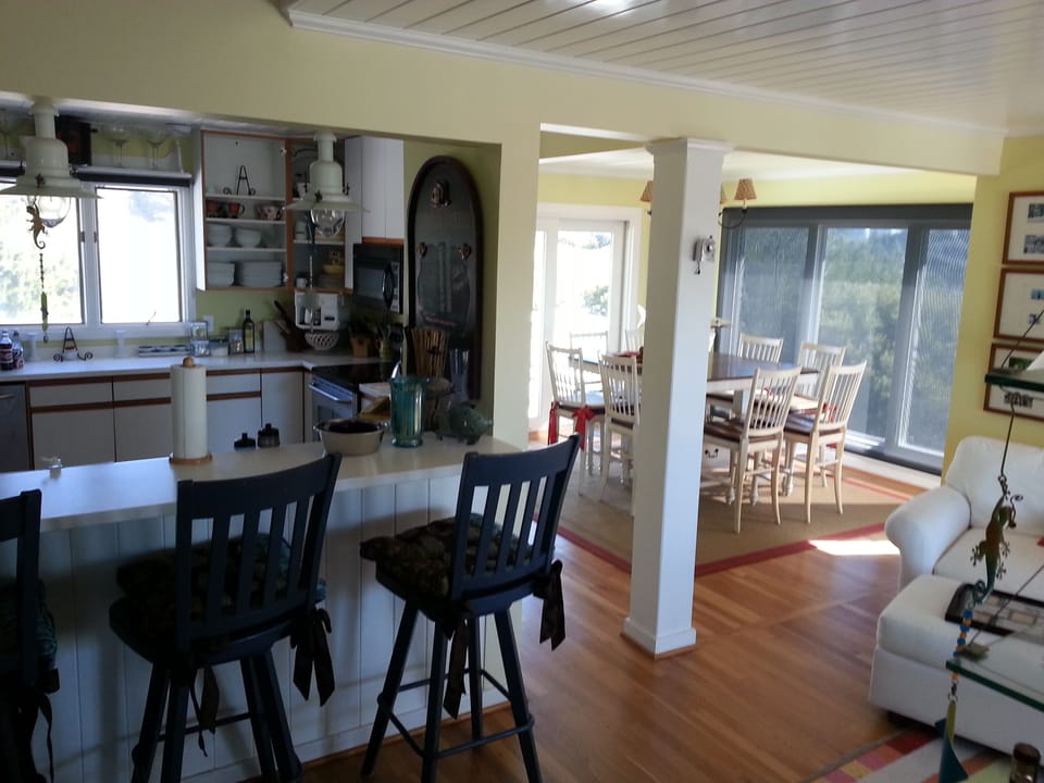 Kitchen, bar, and dining room