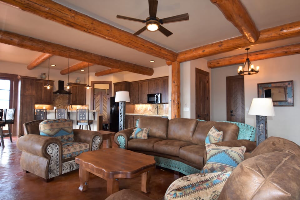 Upscale Living room and kitchen with custom furniture and high end finishes.