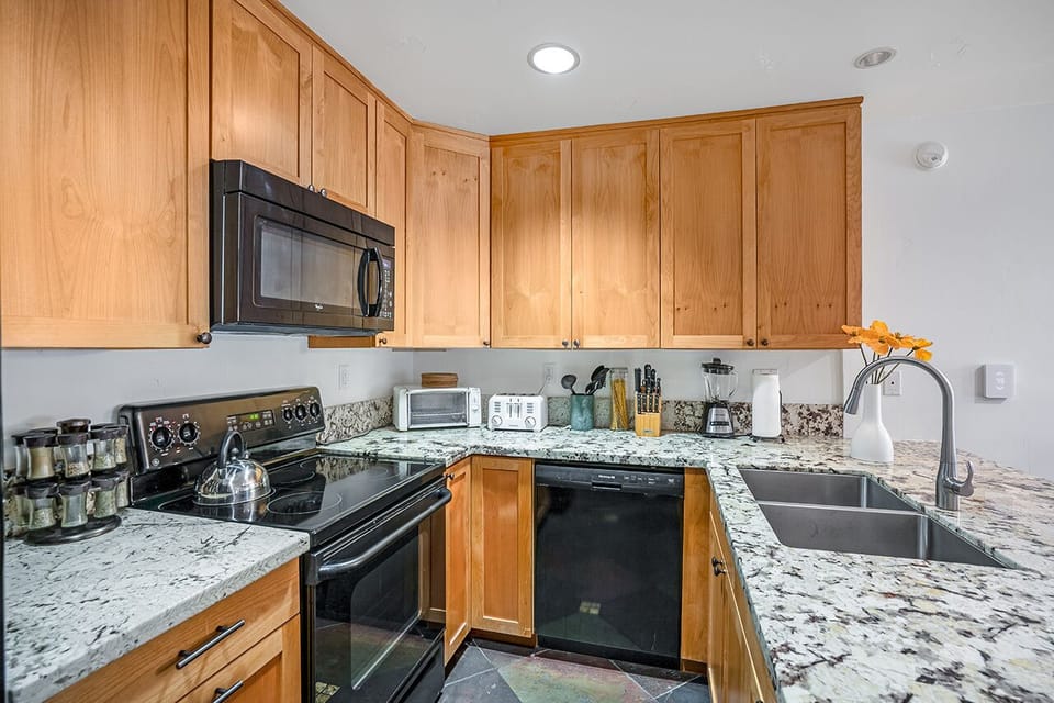 Updated kitchen with granite and all the cooking supplies you will need 