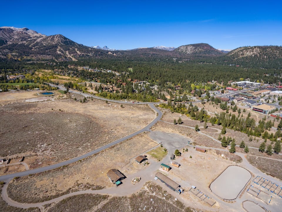 Aerial showing how close the ranch is to the main road, yet on the edge of town.