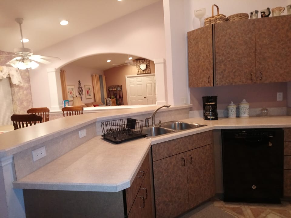 Kitchen with open view of dining room and living room