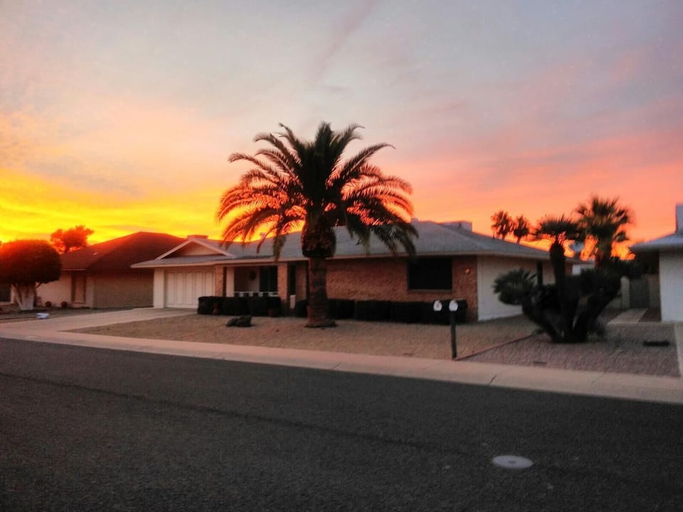 Front of house with sunset