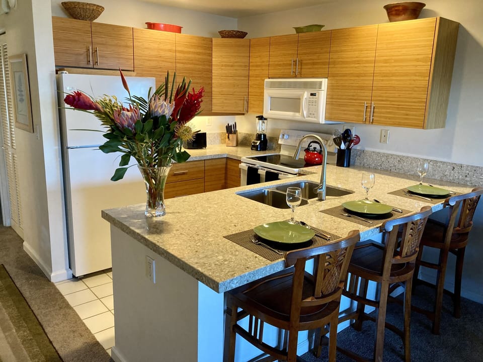 Kitchen with bar seating, new quartz countertops.