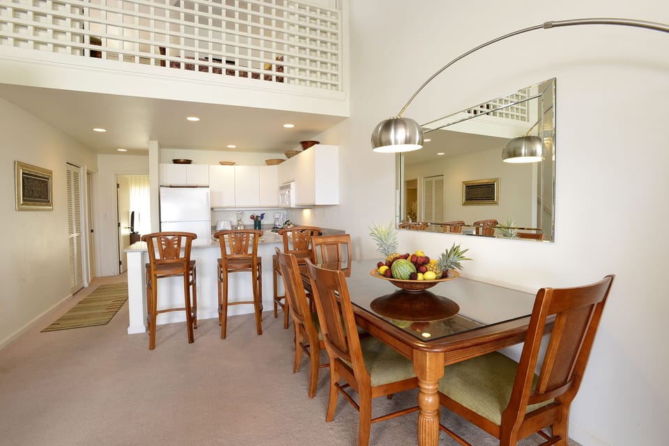 Formal dining area and bar seating for flexible dining options
