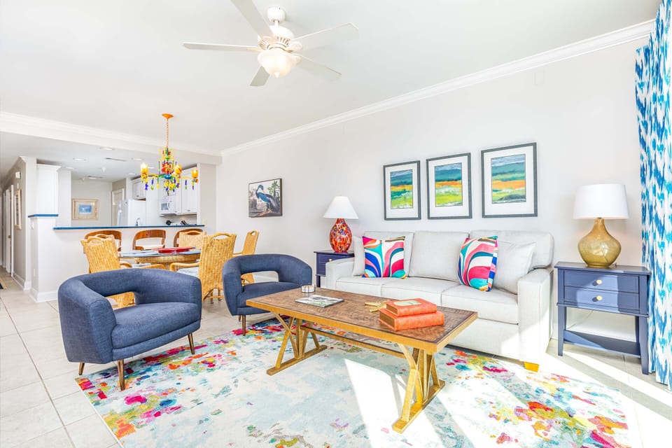 Living area with sleeper sofa, TV, and access to balcony