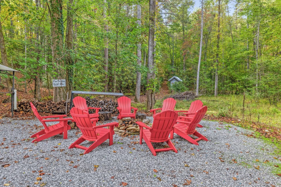 Large family friendly fire pit located in common area behind cabins