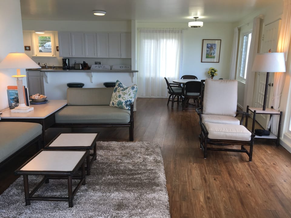 Relax in this lovely living room where you can sit an see the ocean just beyond
