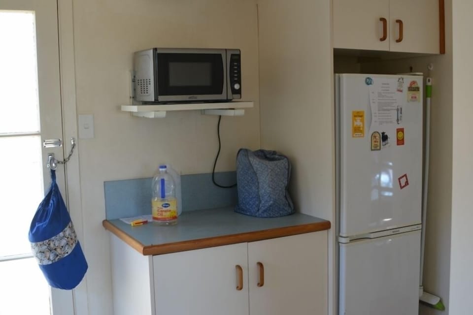 Kitchen area leading to Bathroom Area