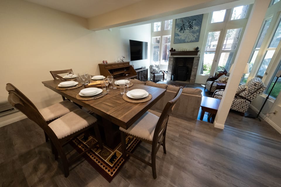 View of the dining room, and the living room. New counter-top height table.