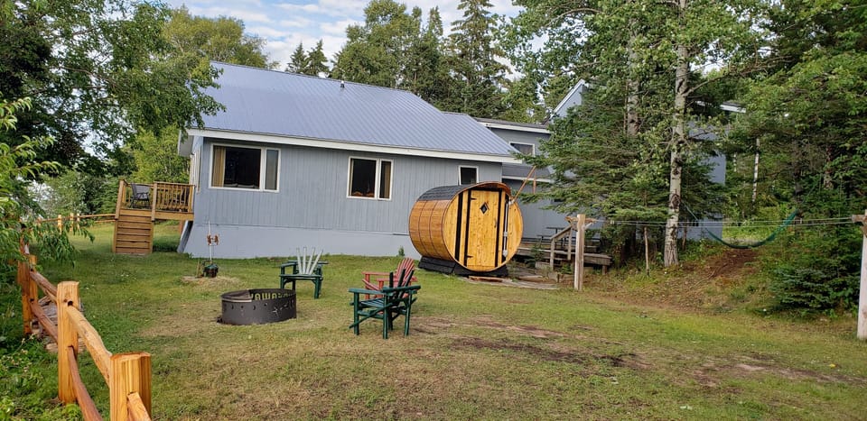 A view of the Sauna, firepit, lakeside deck, hammock and BBQ/Picnic deck.