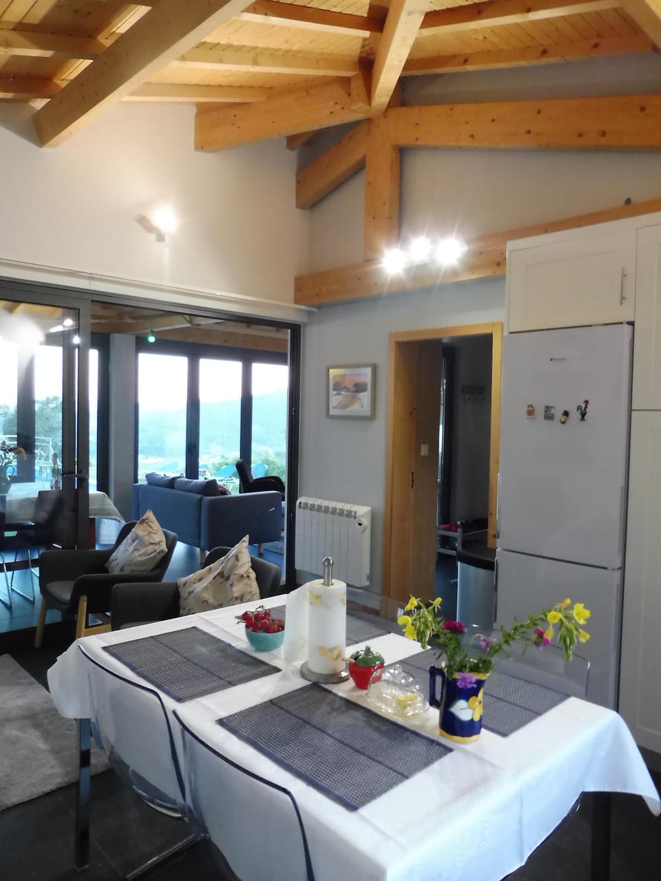 Kitchen overlooking pool at front and back garden