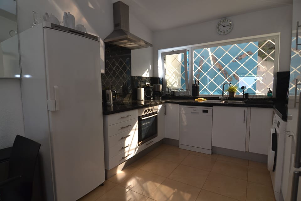 Fully equipped kitchen with plenty of refrigerator space.