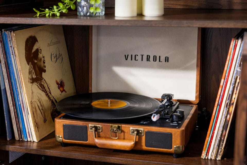 A spin through time – Dust off the day with a hand-picked record and fill the room with the crackle of classic vinyl from our Victrola setup.