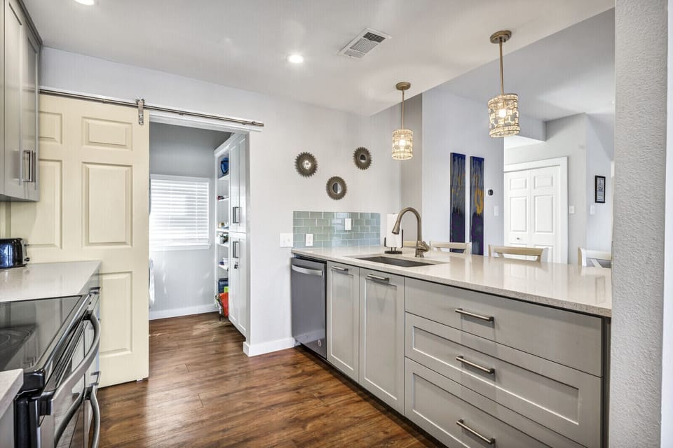 Kitchen bar seats four. Nice pantry. 