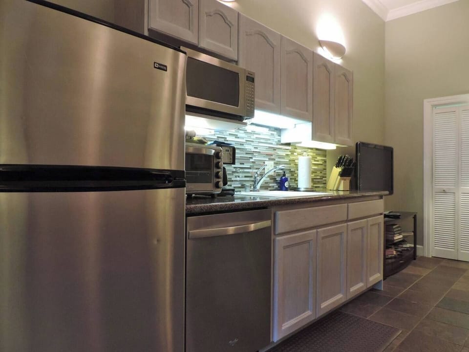 Kitchen area with stainless steel appliances 