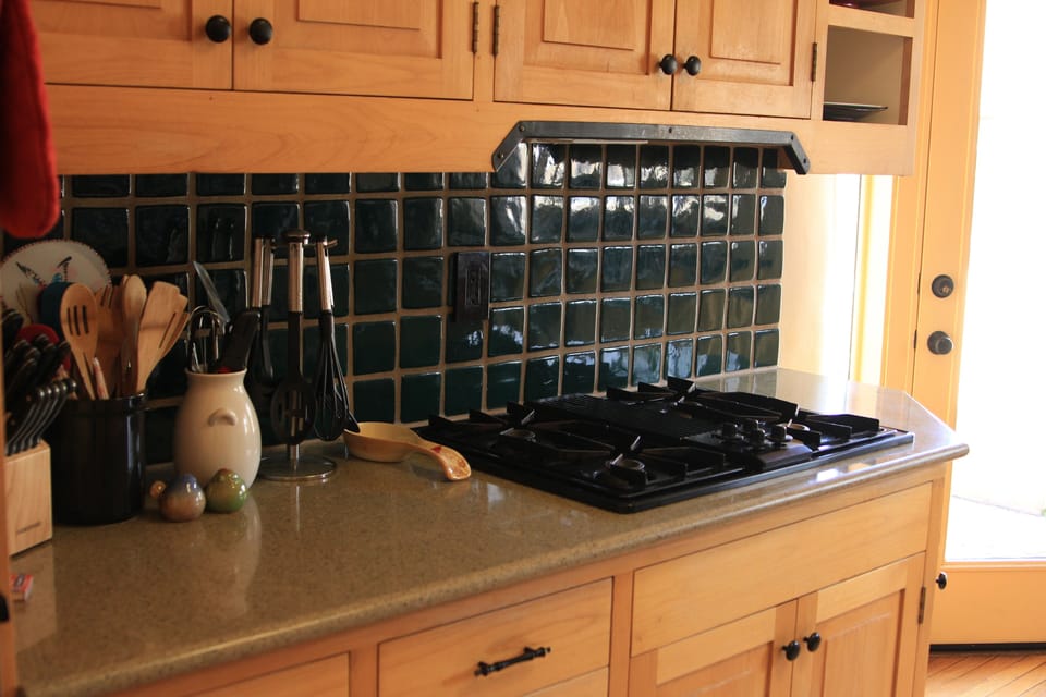 Custom tile throughout kitchen.