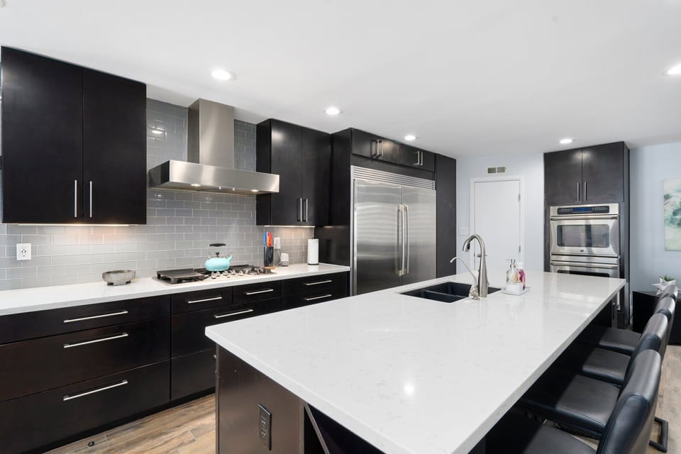 Chefs kitchen with oversized kitchen island.