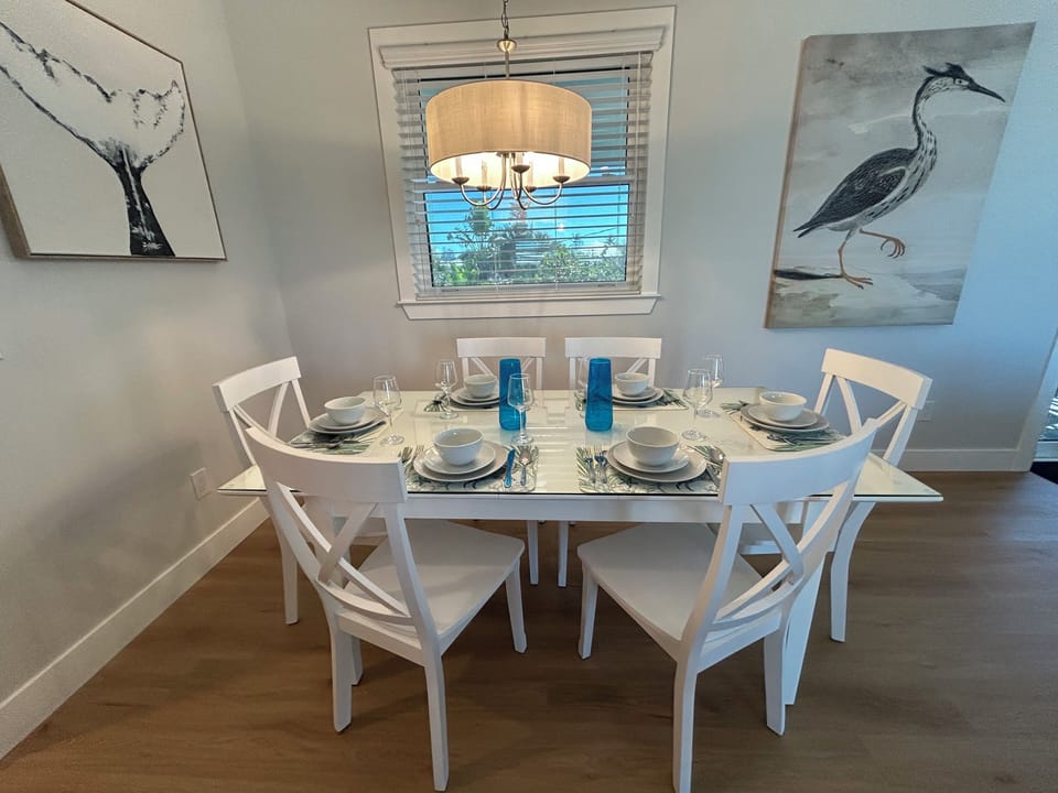 Dining for six at the table.  Seating for three more at the island.