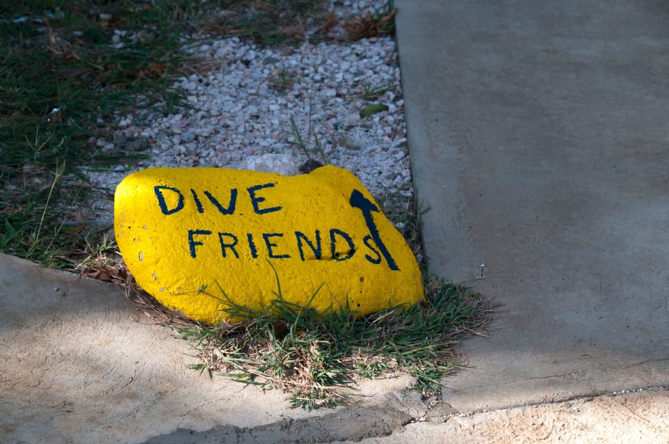 Rock marking the walkway to Dive Friends' dive shop next door to our building.