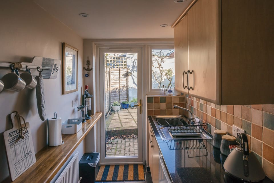 Kitchen leading out to the courtyard garden for a spot of al fresco dining.