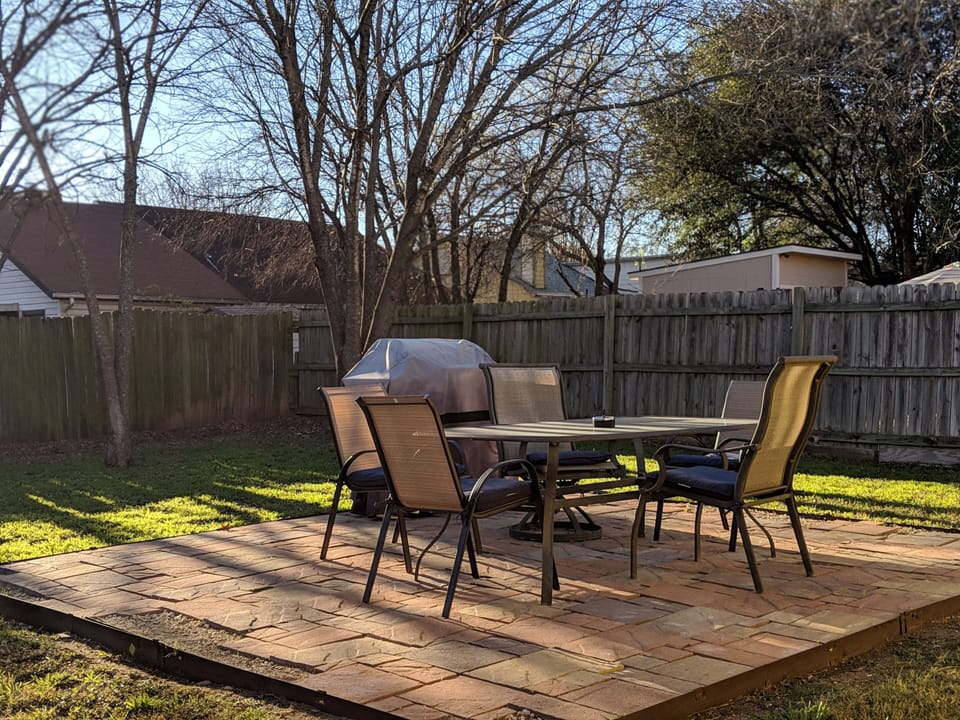 Backyard w/ grill and seating