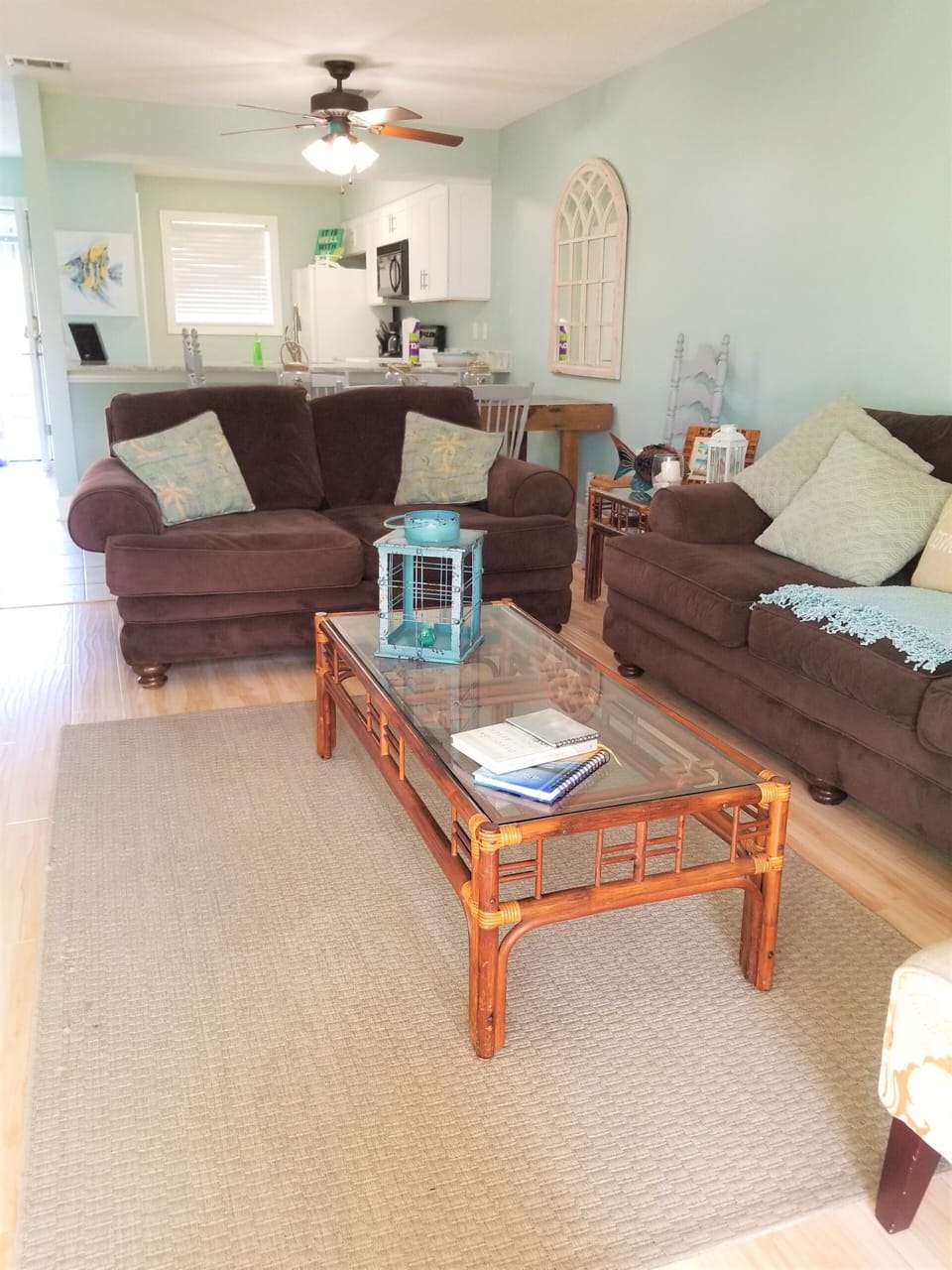 Fresh paint in the living, dining, and kitchen with beachy decor!