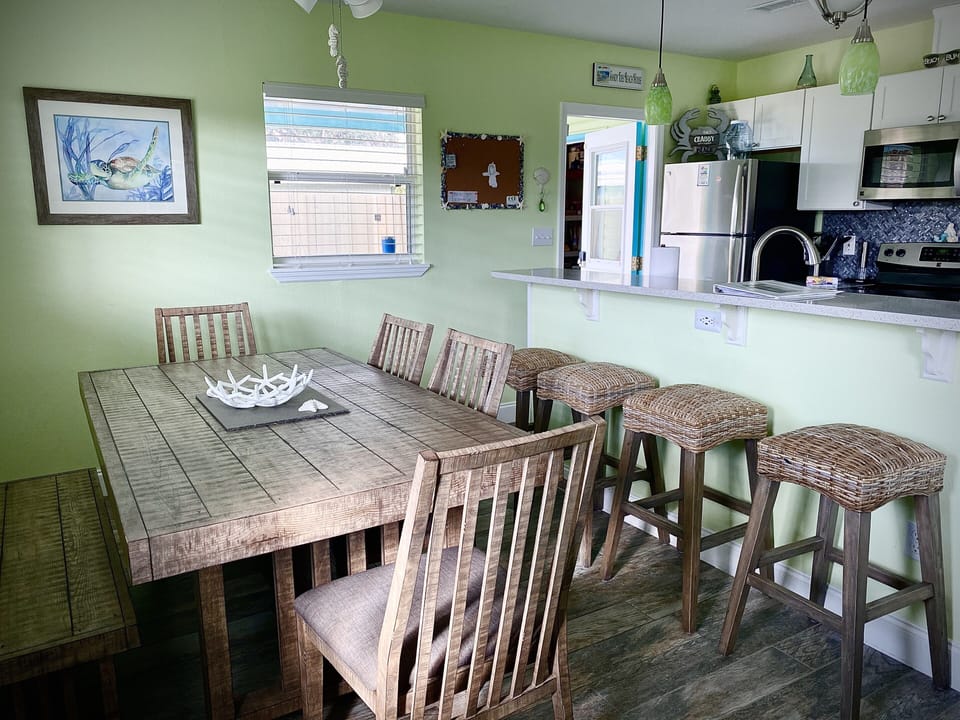 Dining area sits 6 at table and 3 at kitchen bar.
High end furniture 