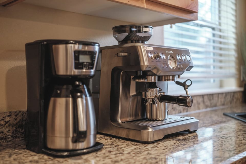 Slow mornings start here. Enjoy espresso or fresh coffee with our Breville espresso maker.