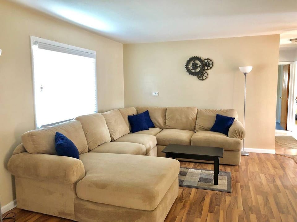 Spacious and comfortable couch with Roku TV and local channels. 