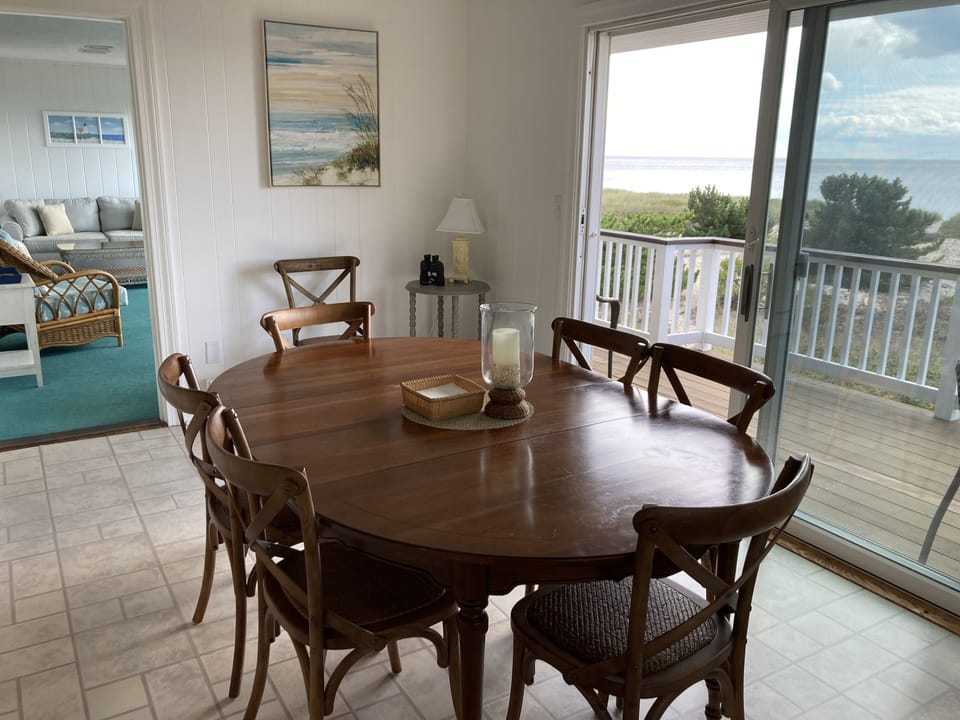 Open dining to deck with beautiful views from a spacious kitchen!