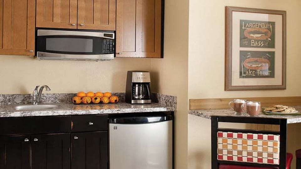 Kitchenette area in lock-off efficiency unit. Note microwave & refrigerator.