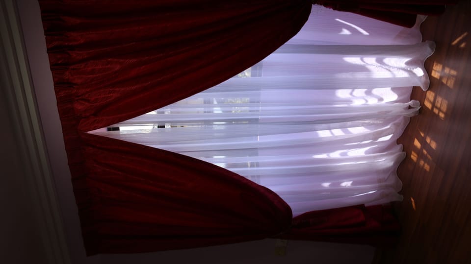  Window with curtain upper level room 4