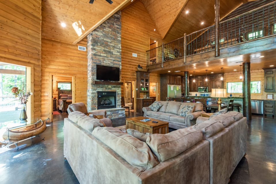 The open living room offers plenty of seating and a cozy gas fireplace.