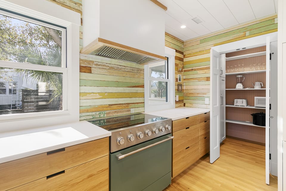 The centerpiece of the remodeled, fully furnished kitchen is a green induction oven.